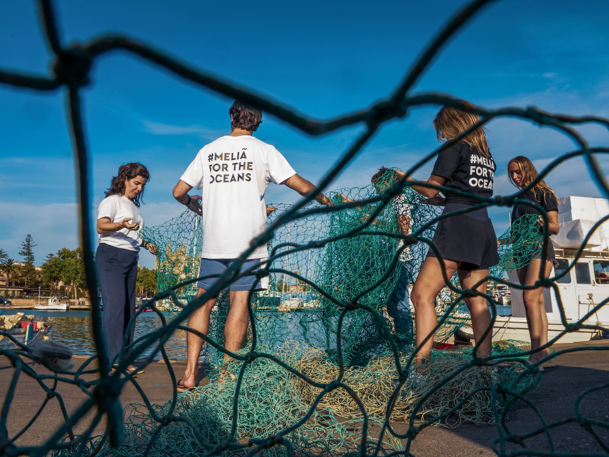 a group of people standing in front of a net