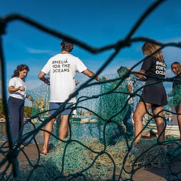 a group of people standing in front of a net