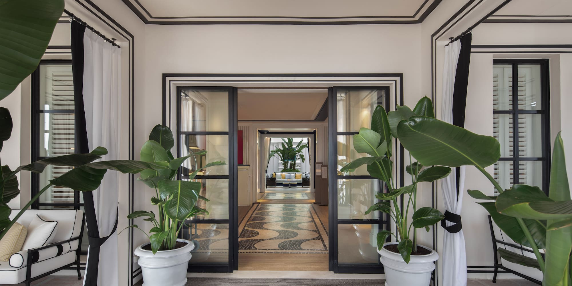 a room with plants in pots