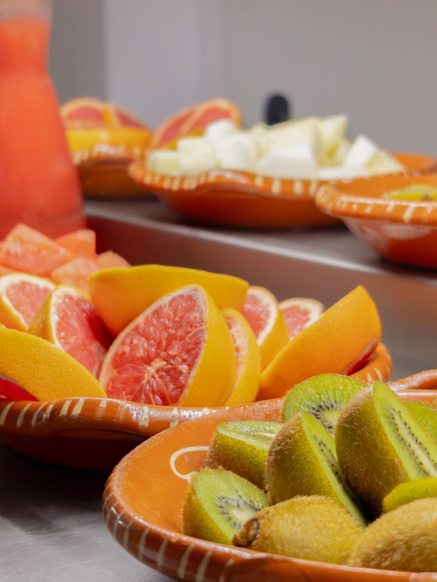 a group of bowls of fruit