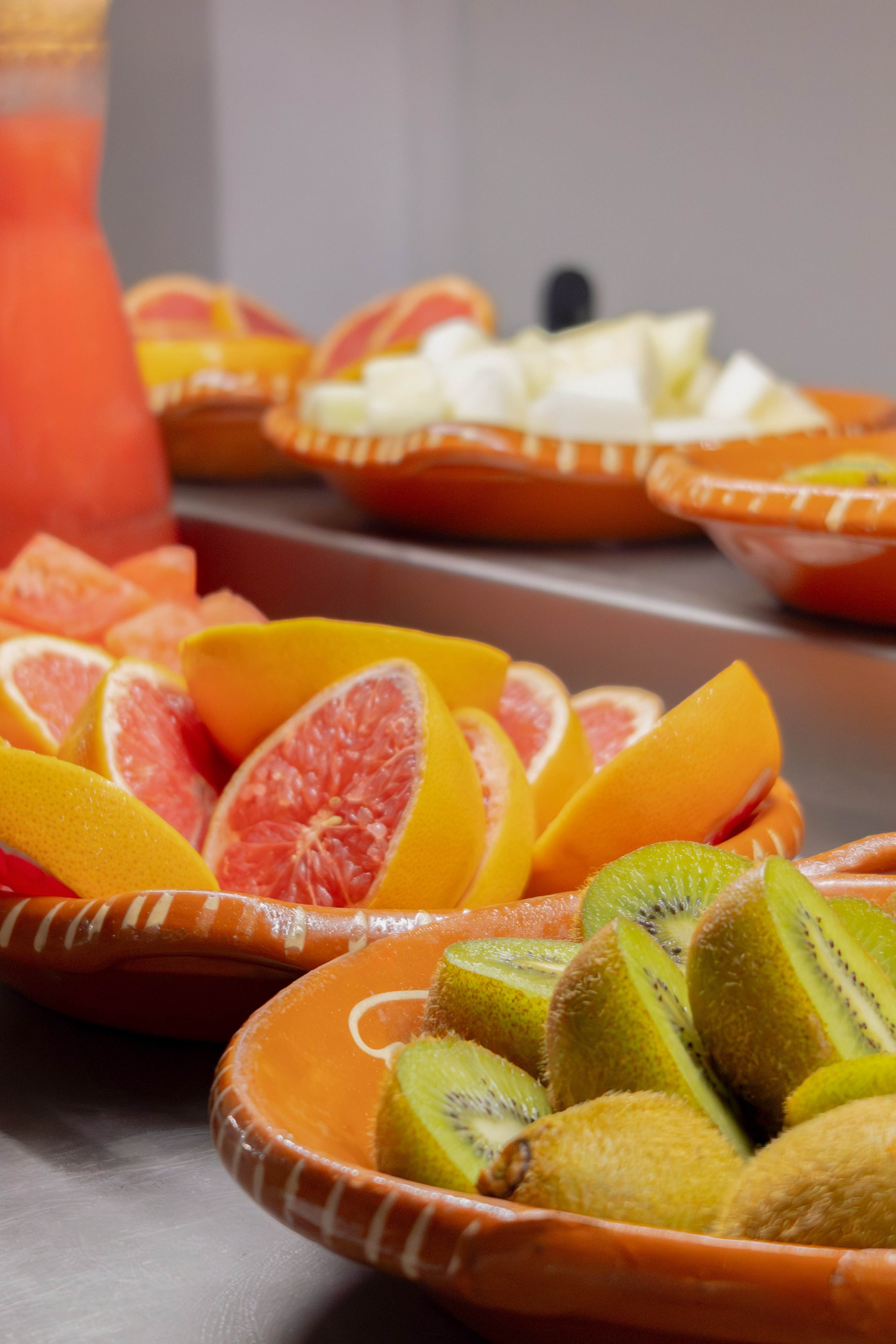 a group of bowls of fruit