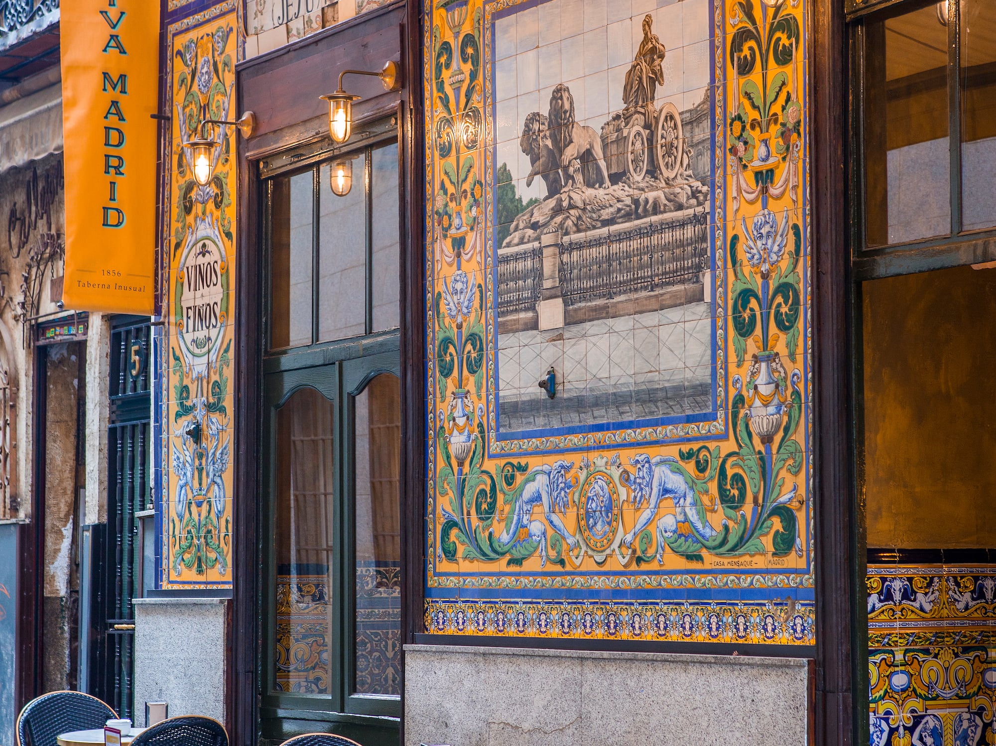 a restaurant with tables and chairs outside