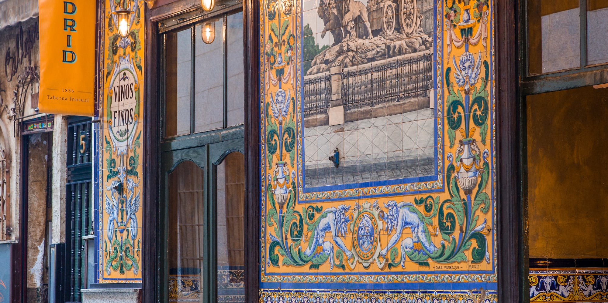 a restaurant with tables and chairs outside