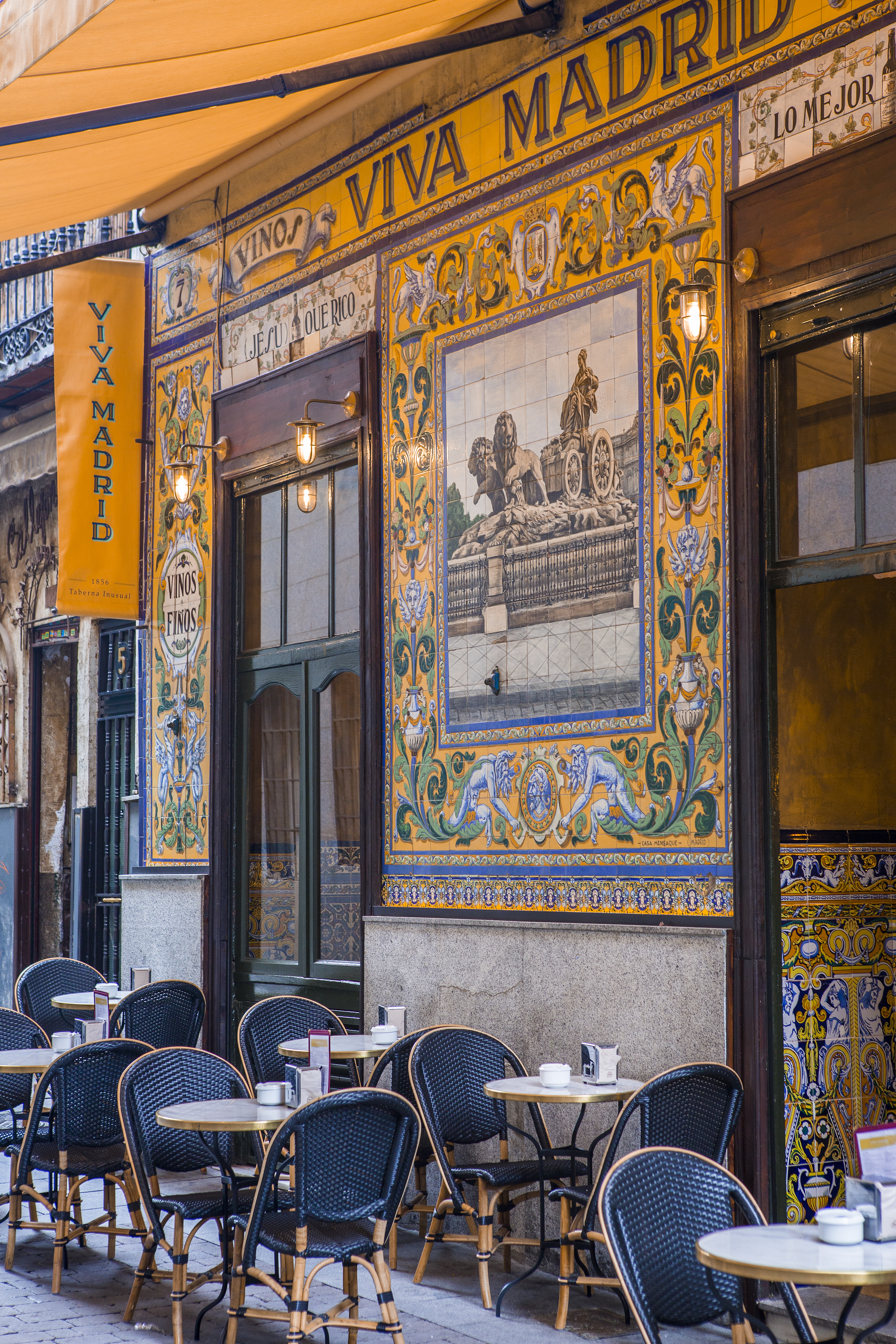 a restaurant with tables and chairs outside