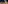 Snowy Christmas tree, historic clock tower, and starry winter night.