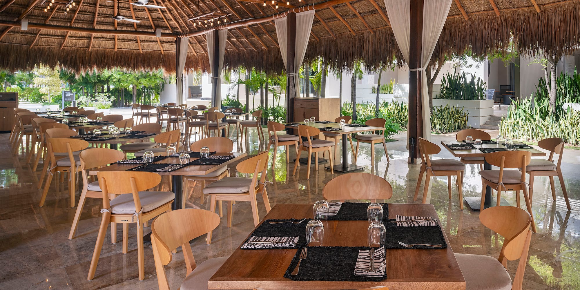 a restaurant with tables and chairs