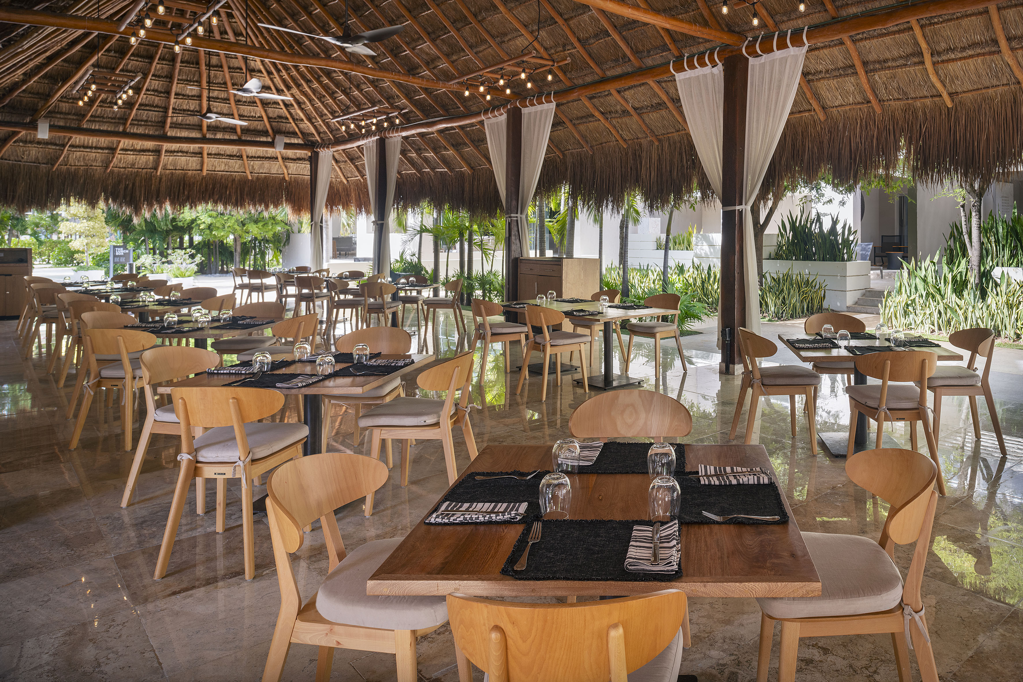 a restaurant with tables and chairs