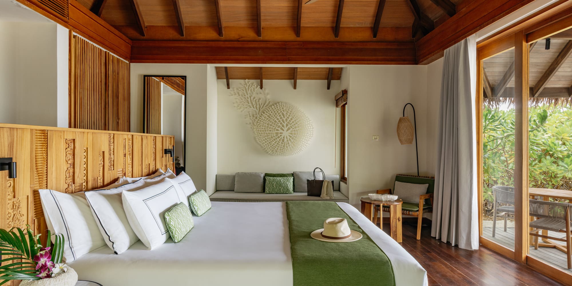 a room with a bed and a fan