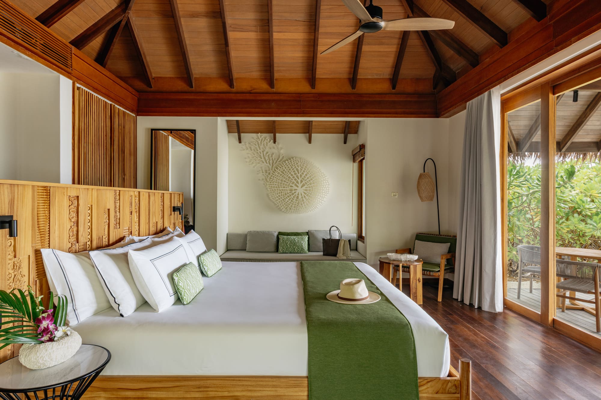 a room with a bed and a fan