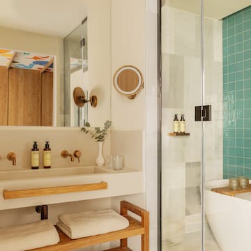 a bathroom with a shower and a sink