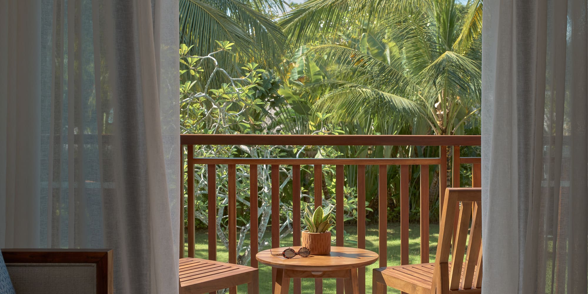 a table and chairs on a balcony