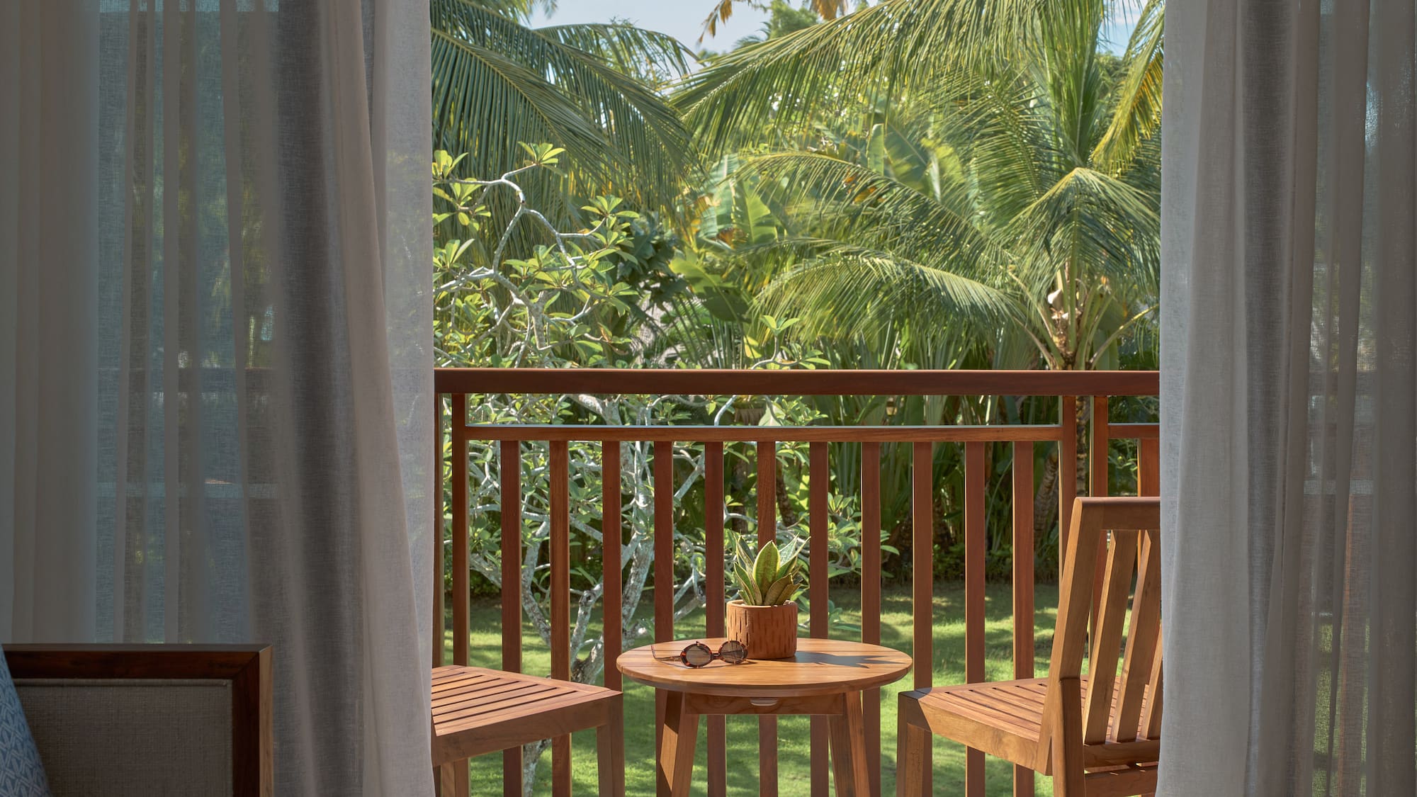 a table and chairs on a balcony