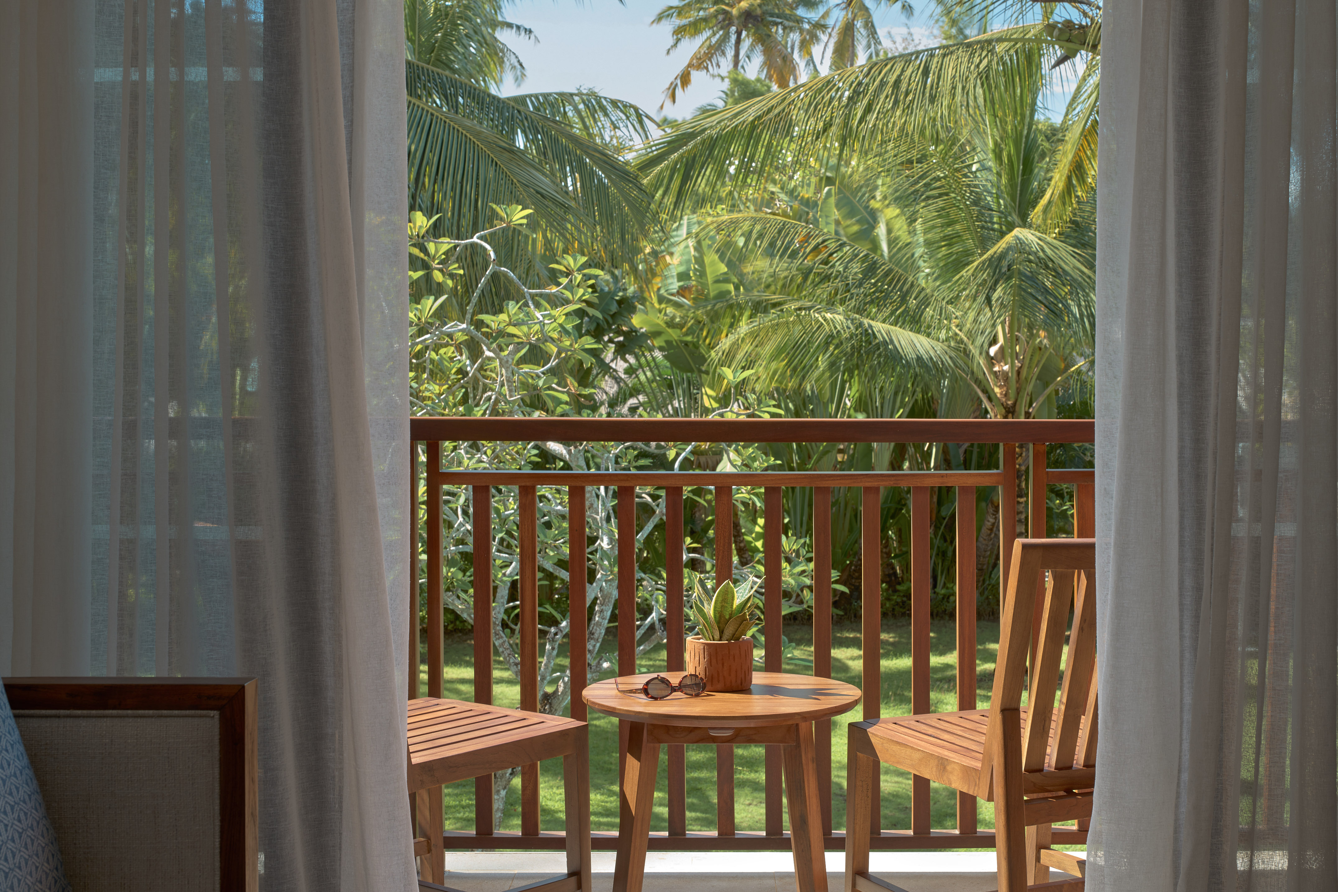 a table and chairs on a balcony