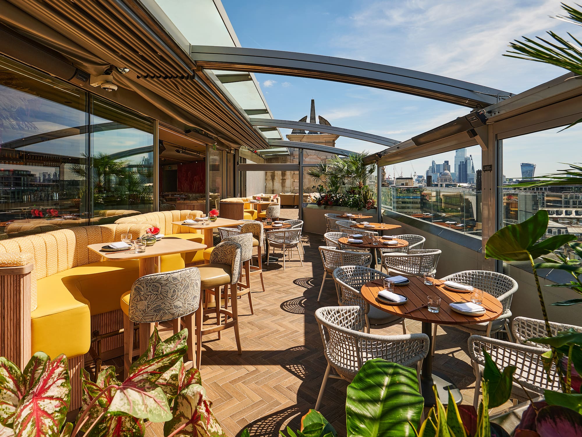 a restaurant with tables and chairs on a patio