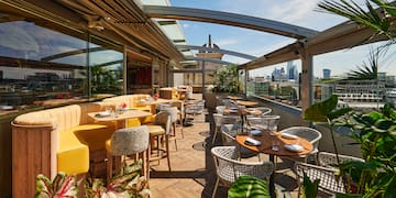 a restaurant with tables and chairs on a patio