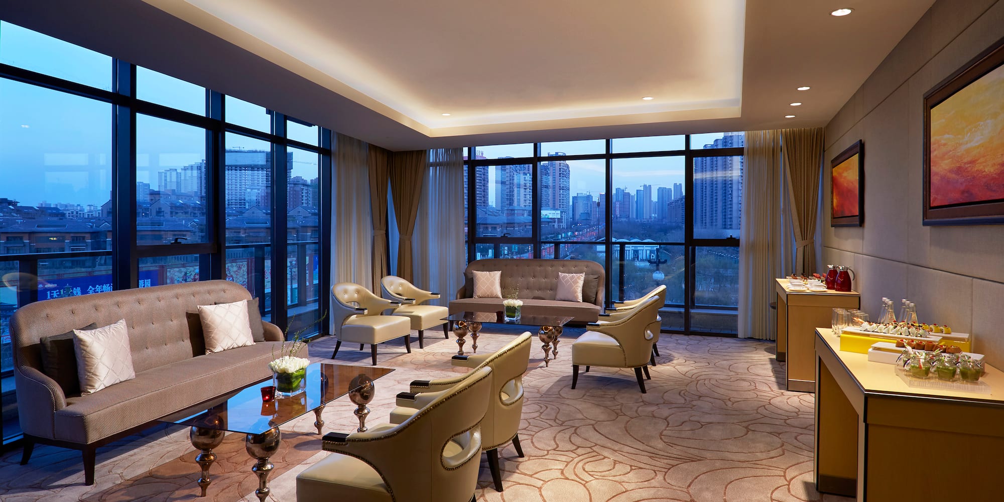 a room with a large window and a city view