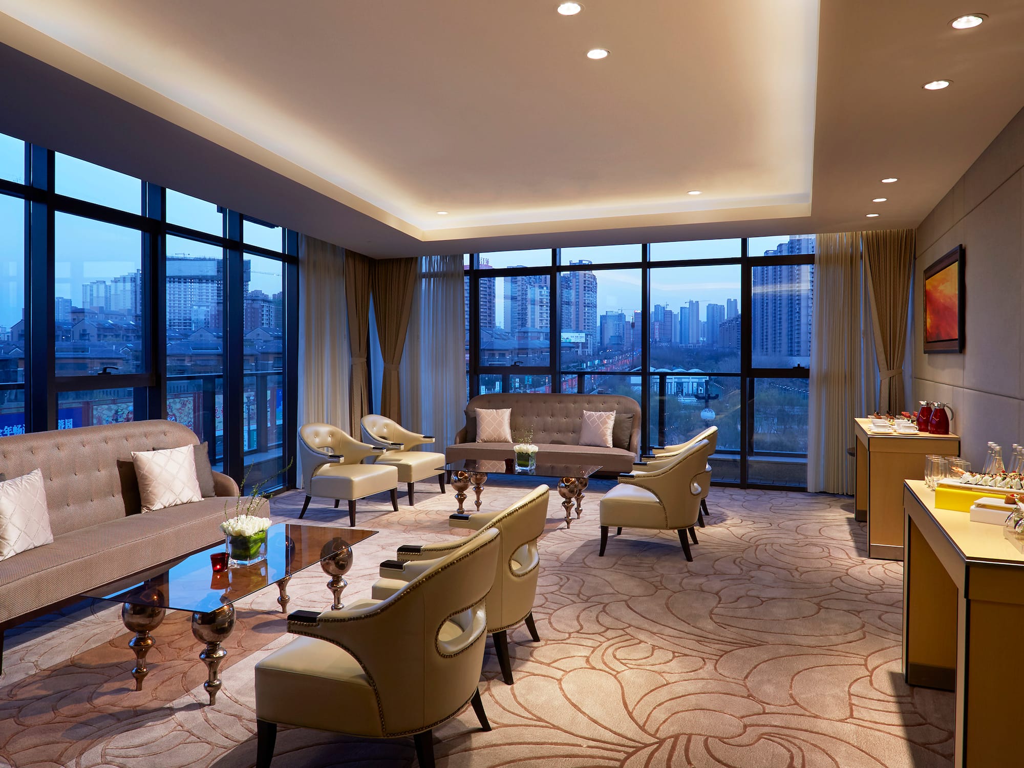 a room with a large window and a city view