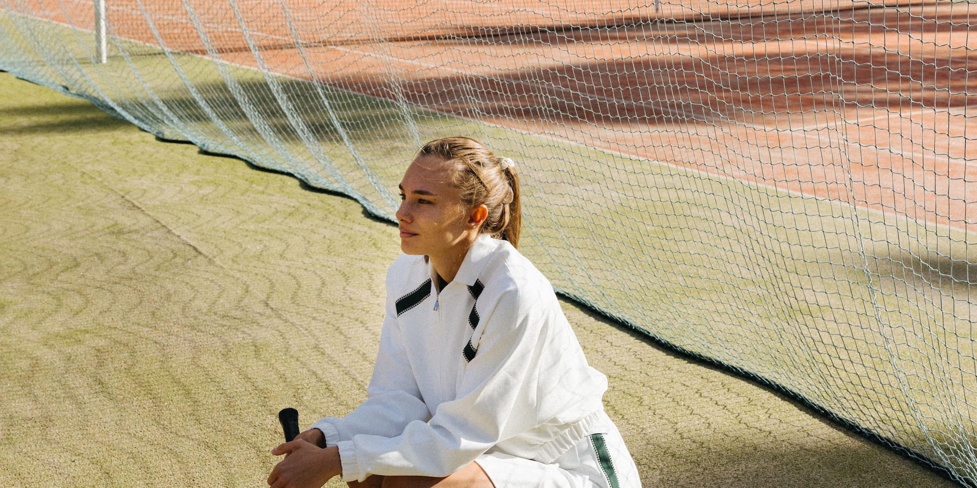 a woman holding a tennis racket
