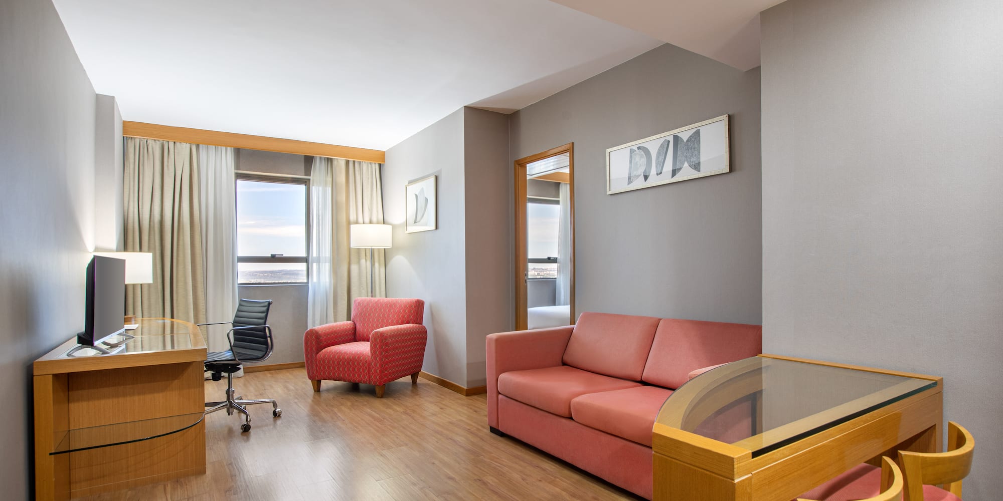 a room with a desk and couch