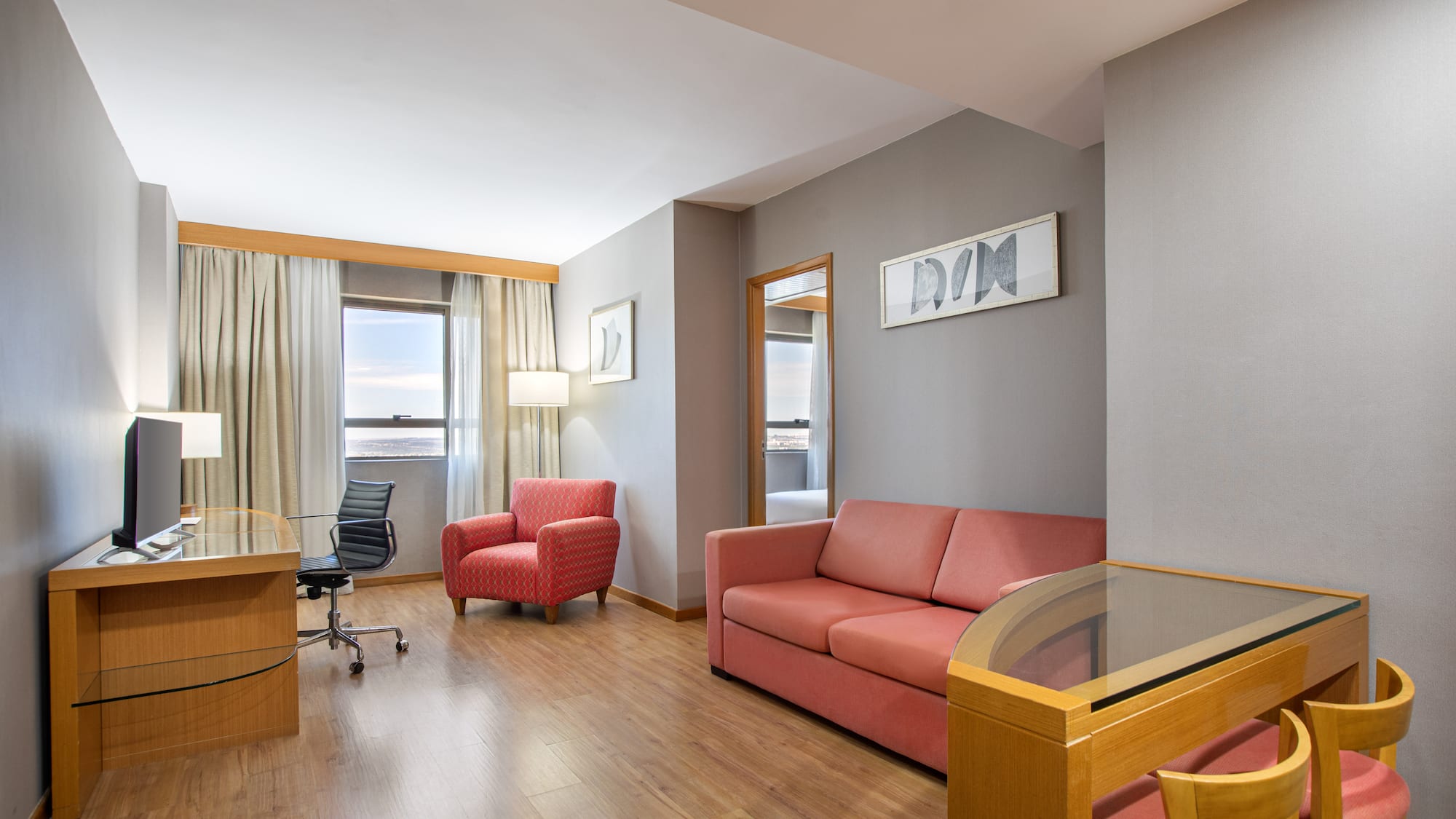 a room with a desk and couch