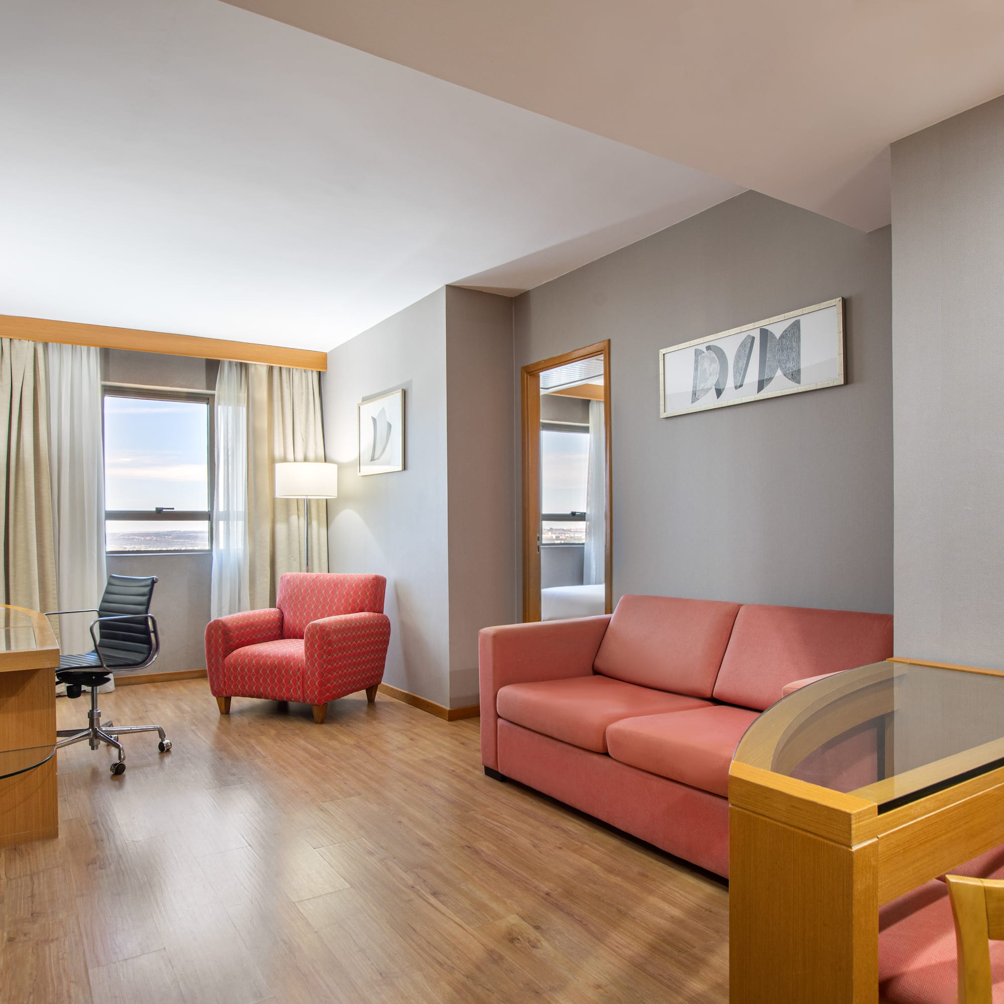 a room with a desk and couch