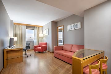 a room with a desk and couch