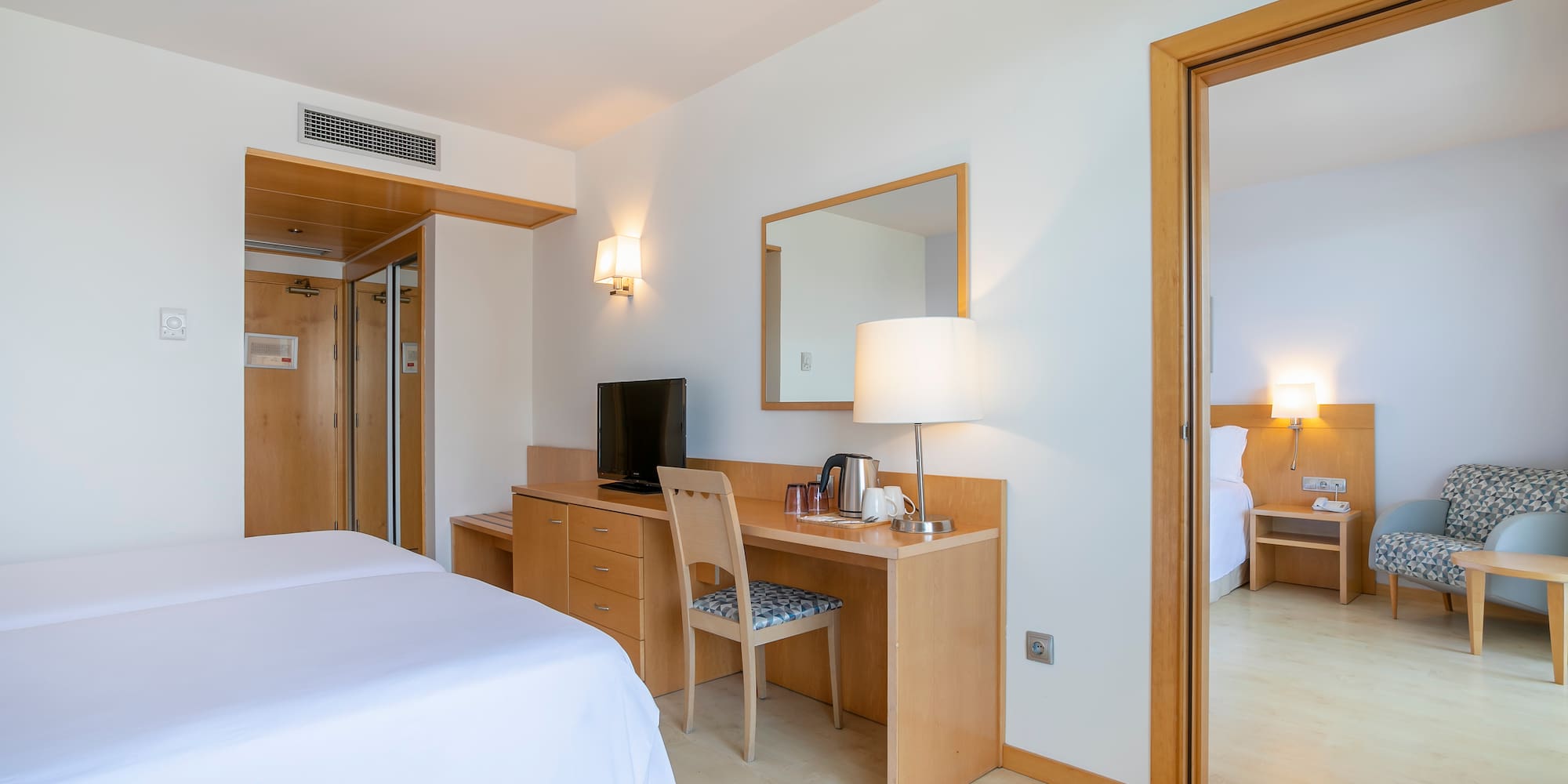 a room with a bed and a desk