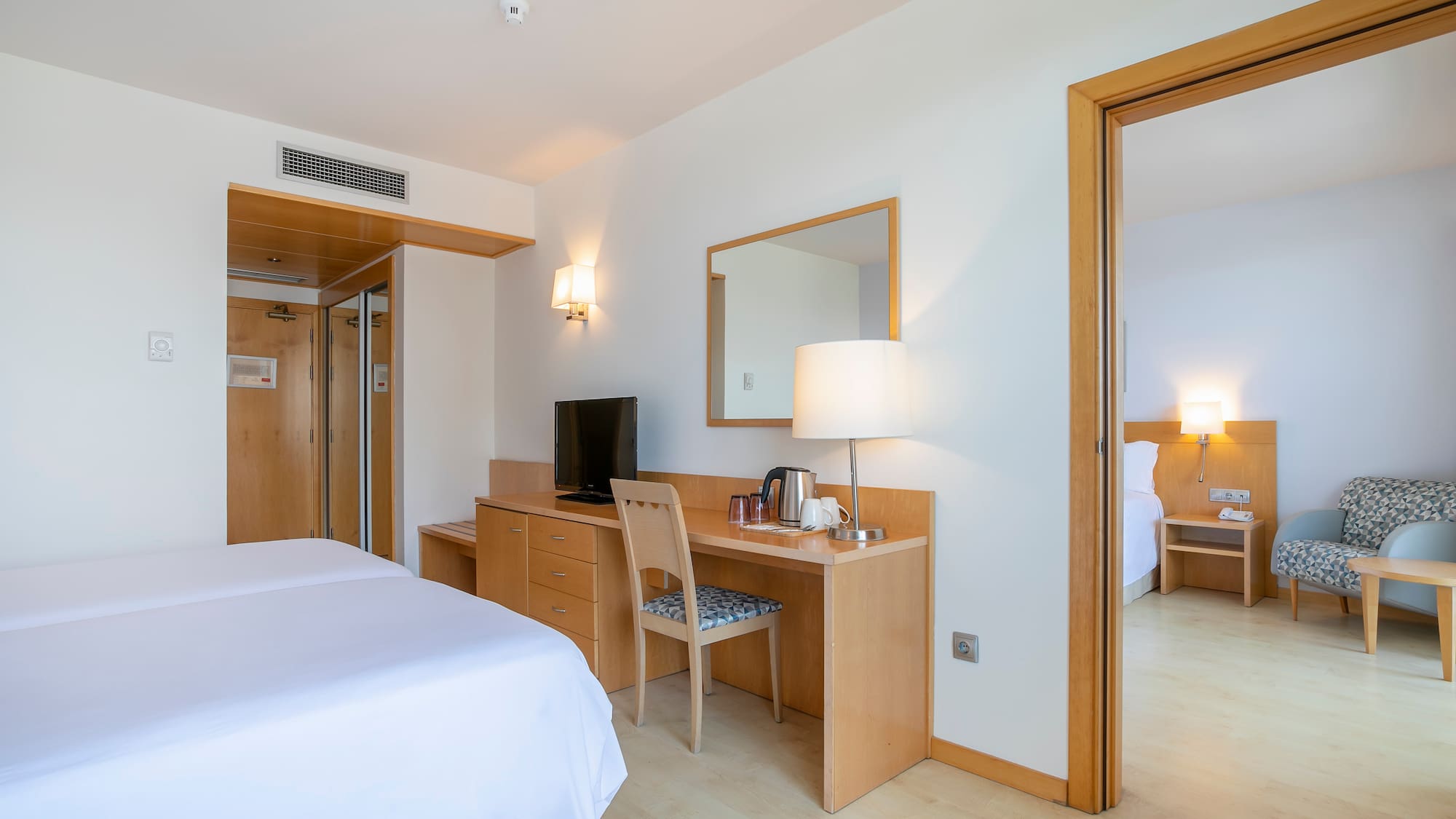 a room with a bed and a desk