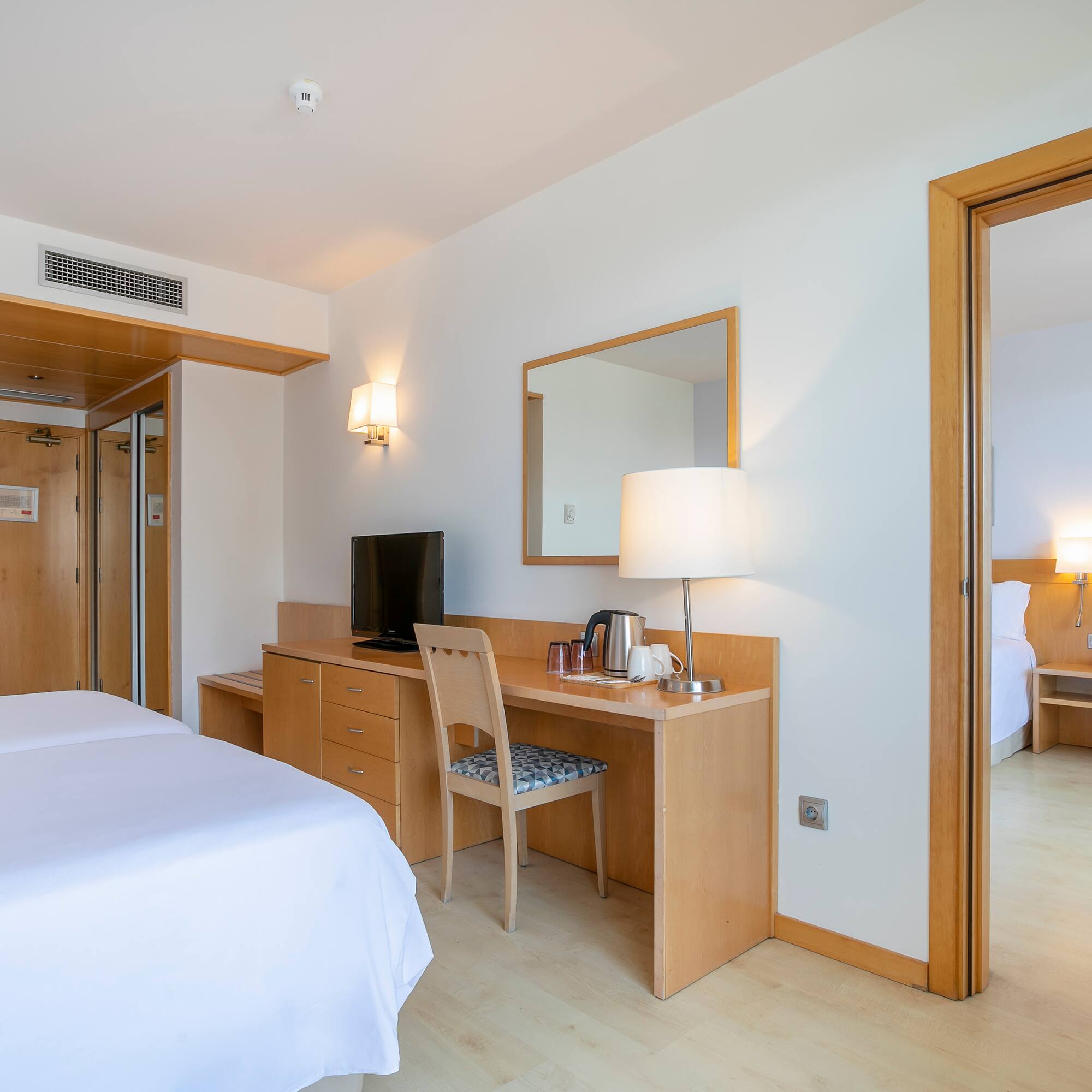 a room with a bed and a desk