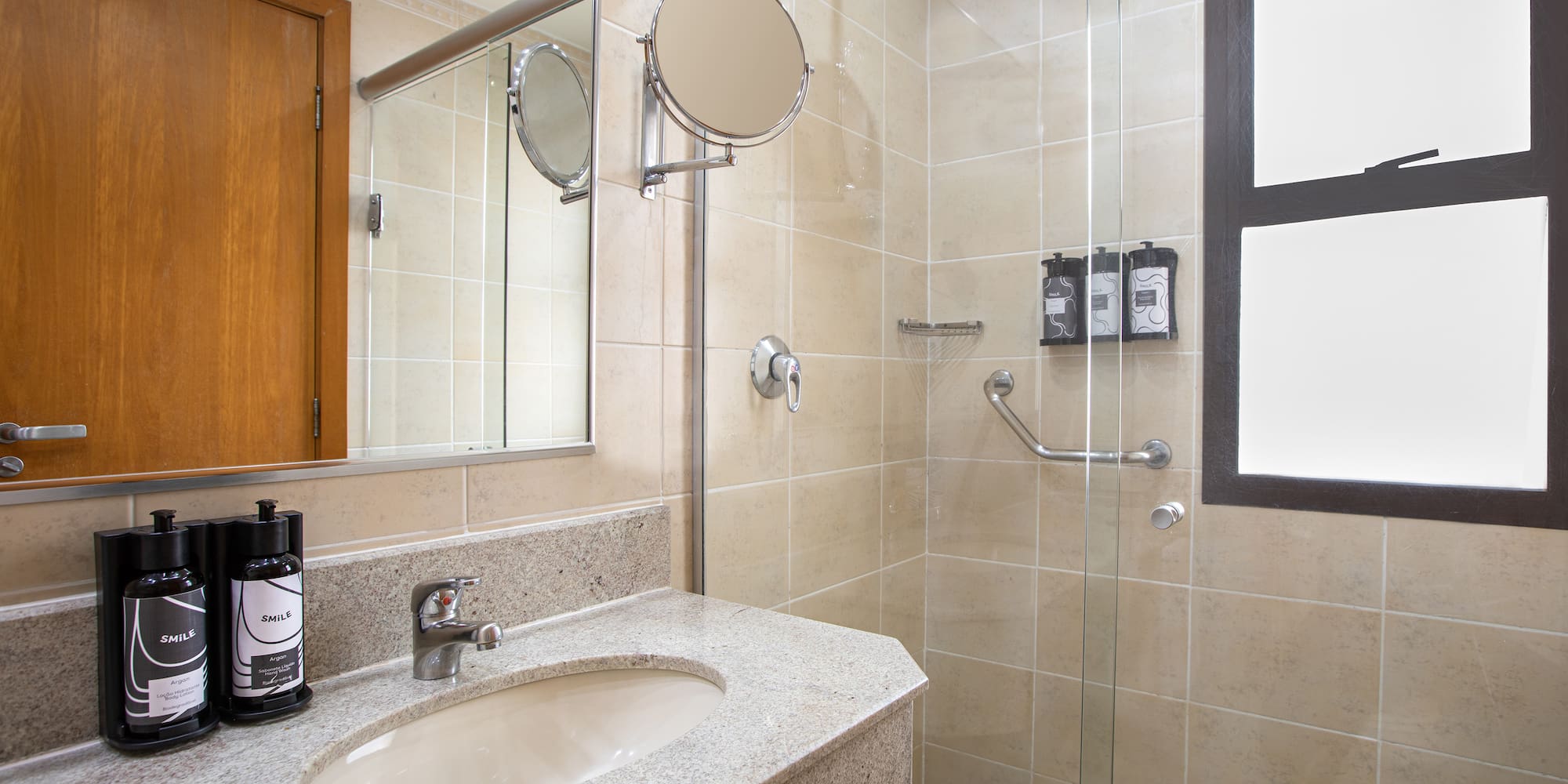 a bathroom with a shower and sink