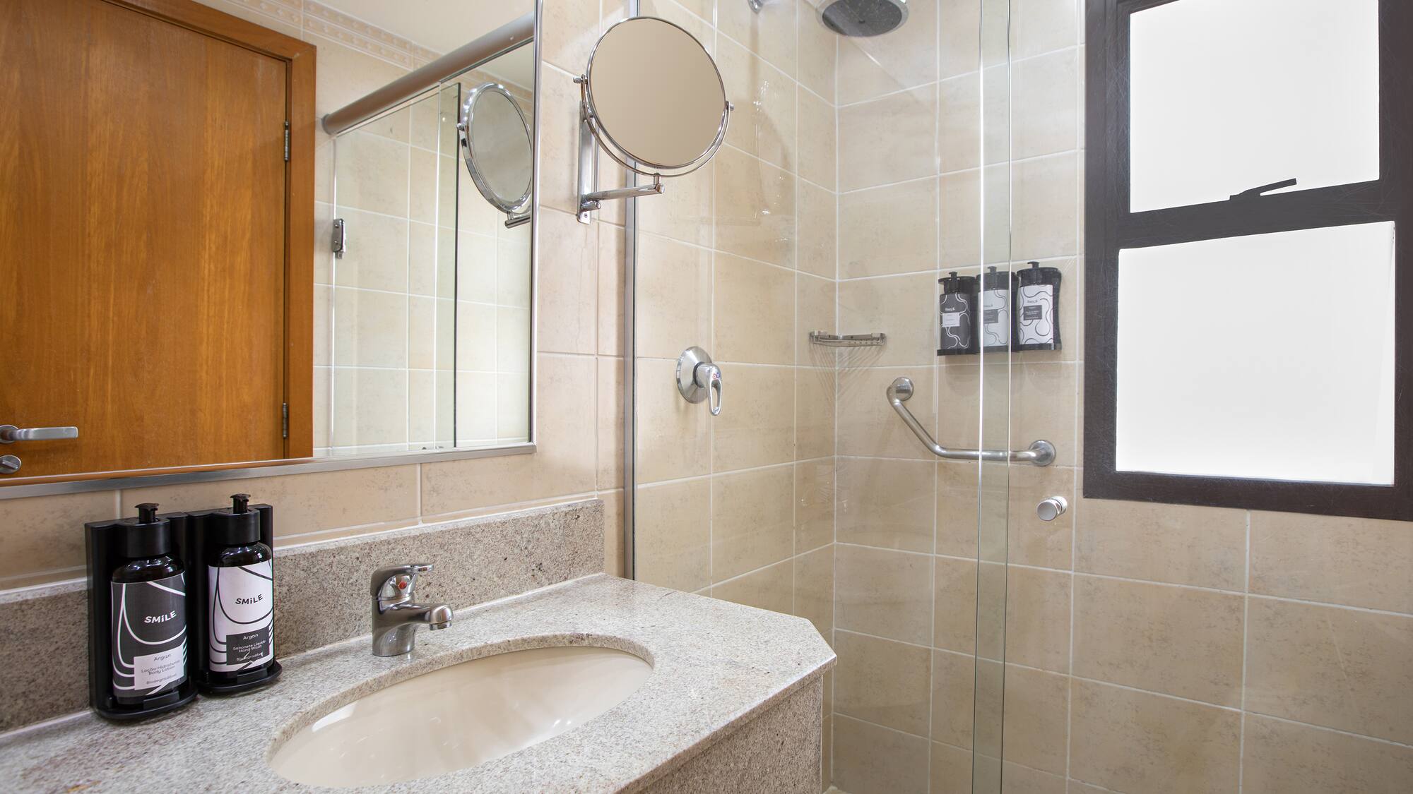 a bathroom with a shower and sink