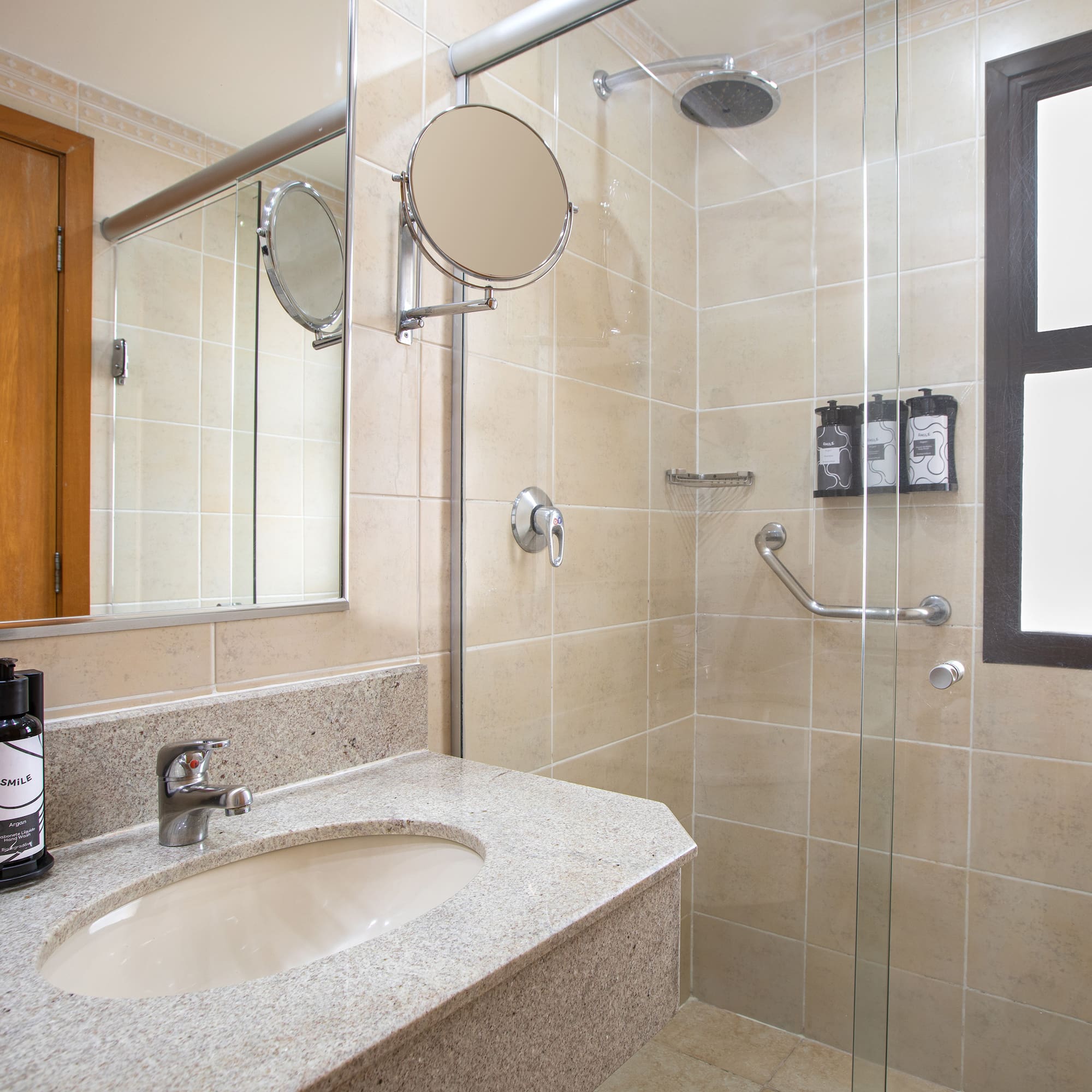 a bathroom with a shower and sink