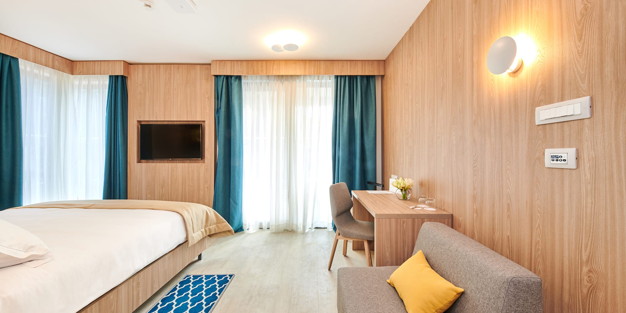 a room with a bed and a desk