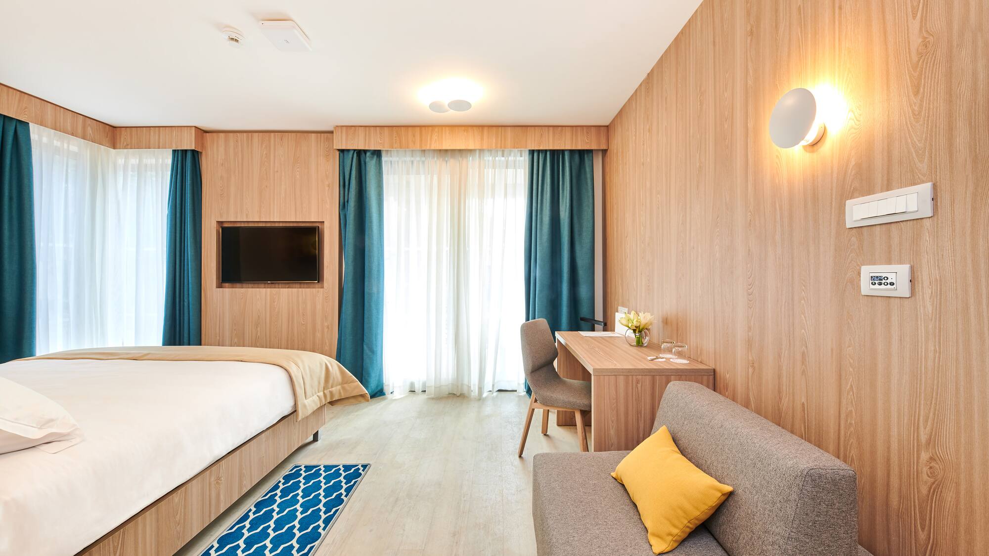 a room with a bed and a desk