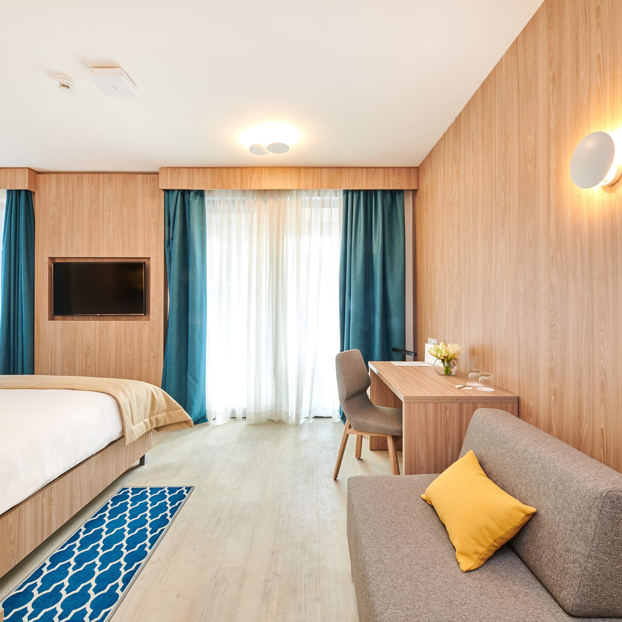 a room with a bed and a desk