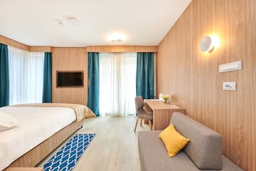 a room with a bed and a desk