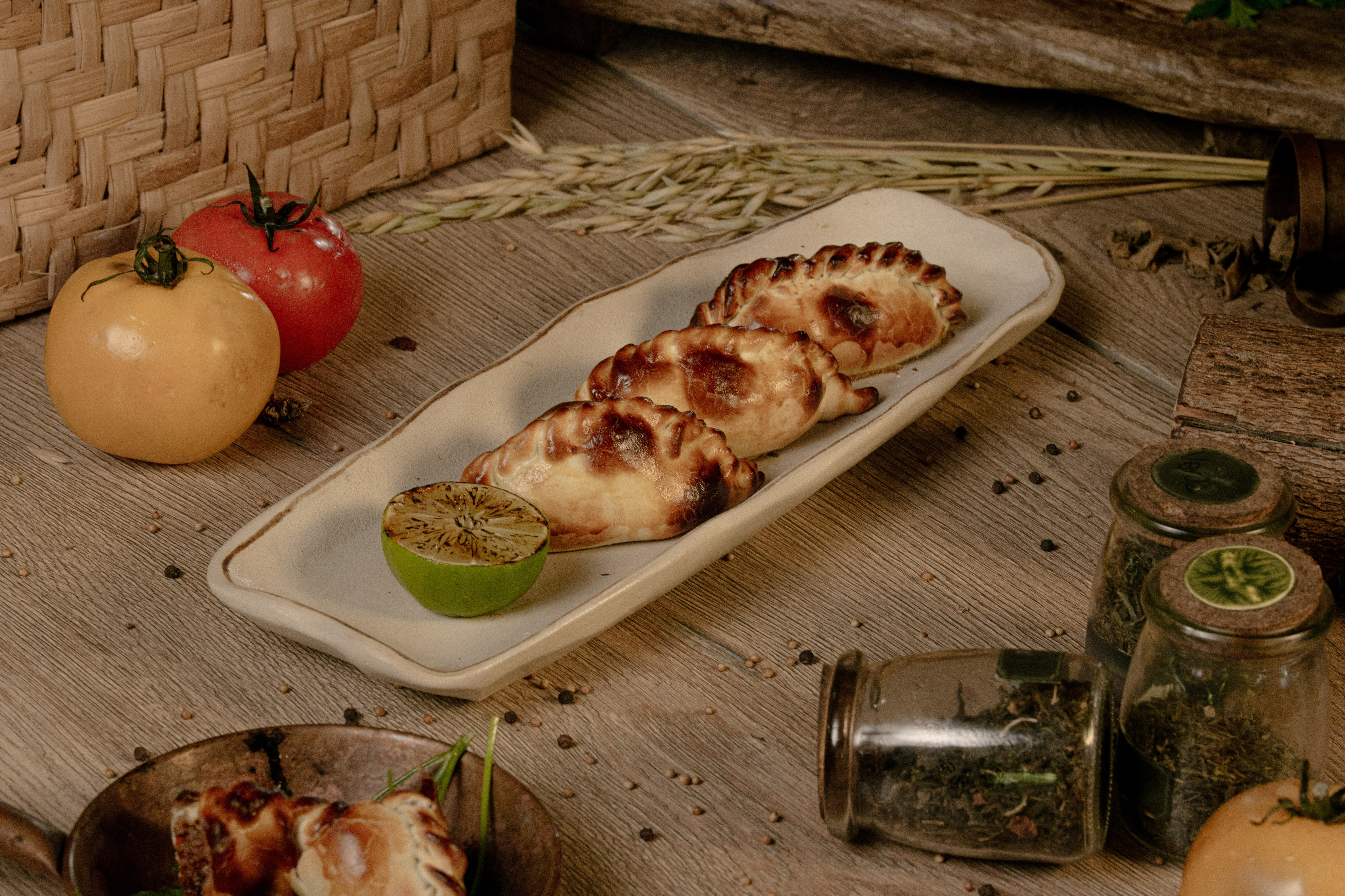 food on a plate next to a couple of glass jars