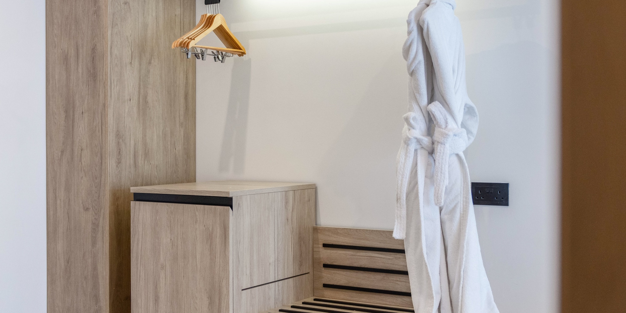 a white robe on a rack