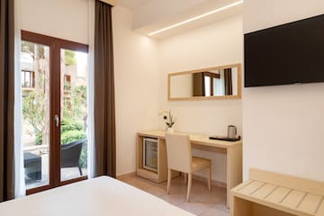 a room with a bed and a mirror