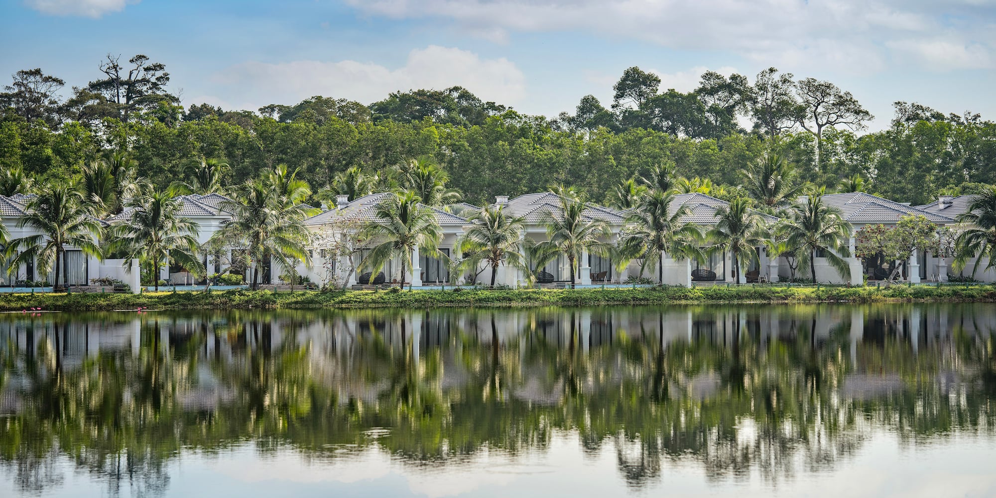 a row of houses next to a body of water
