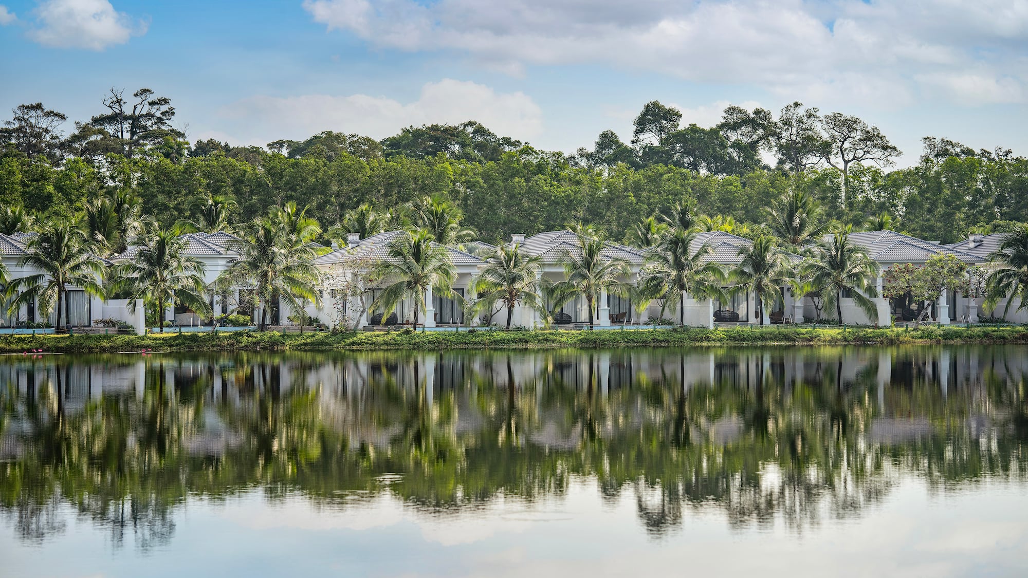 a row of houses next to a body of water
