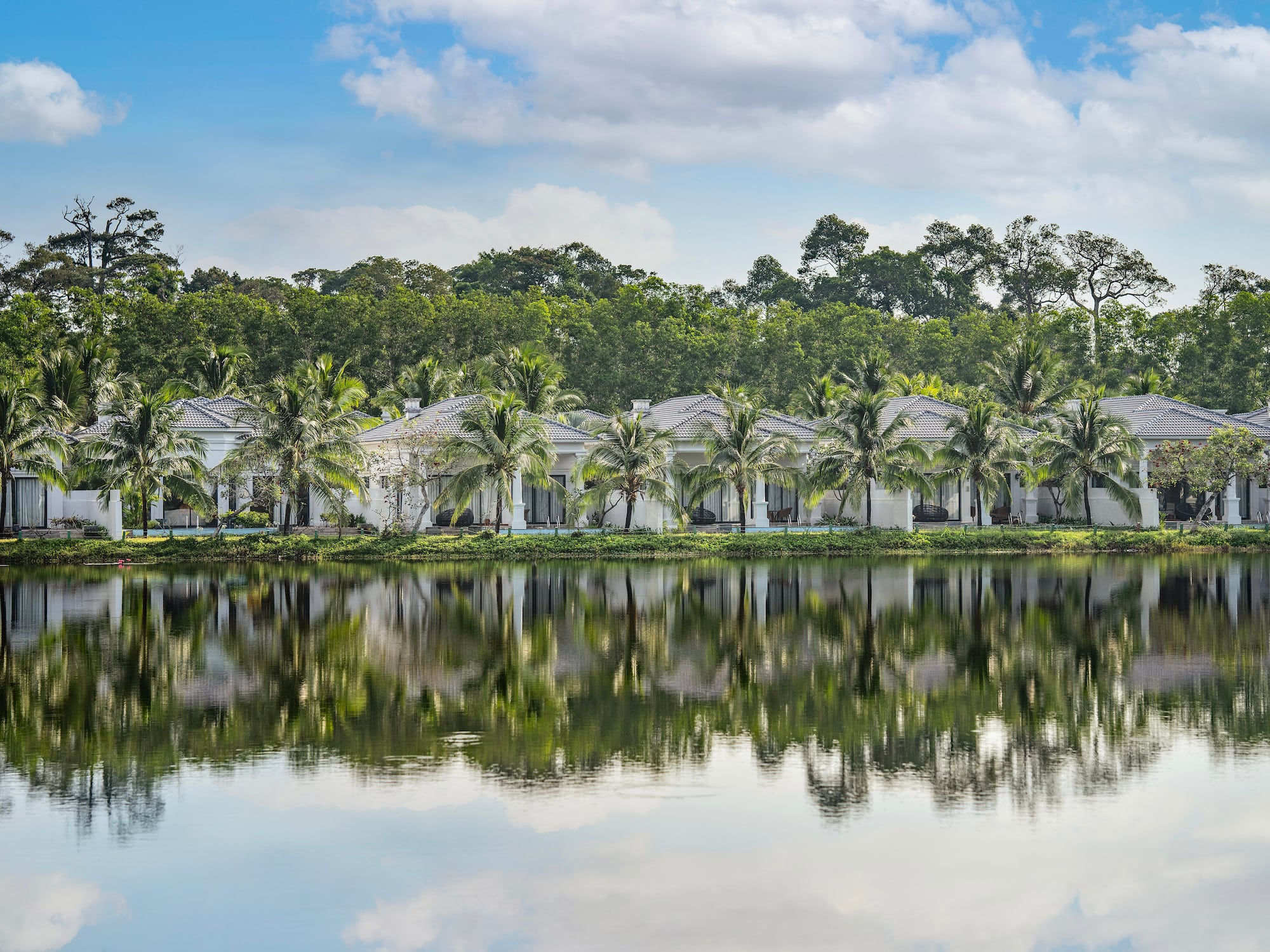 a row of houses next to a body of water