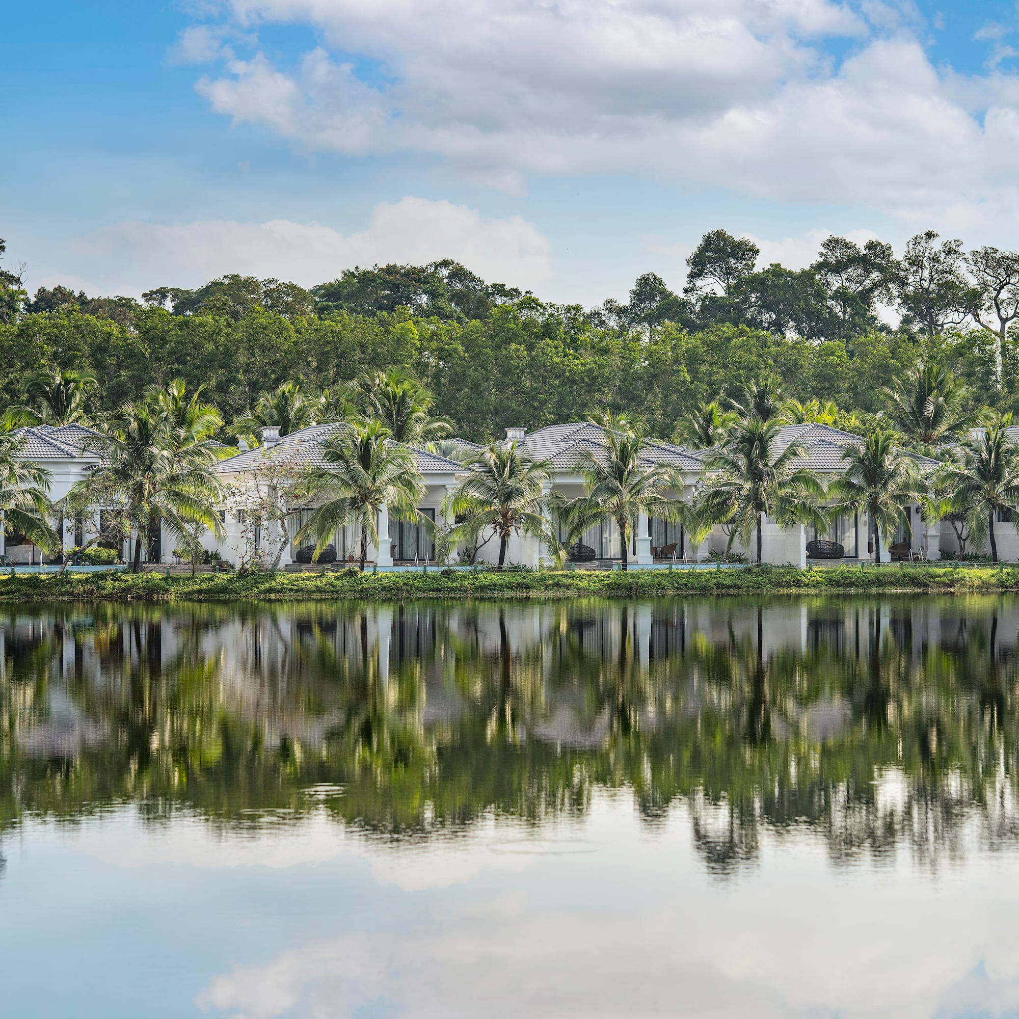 a row of houses next to a body of water