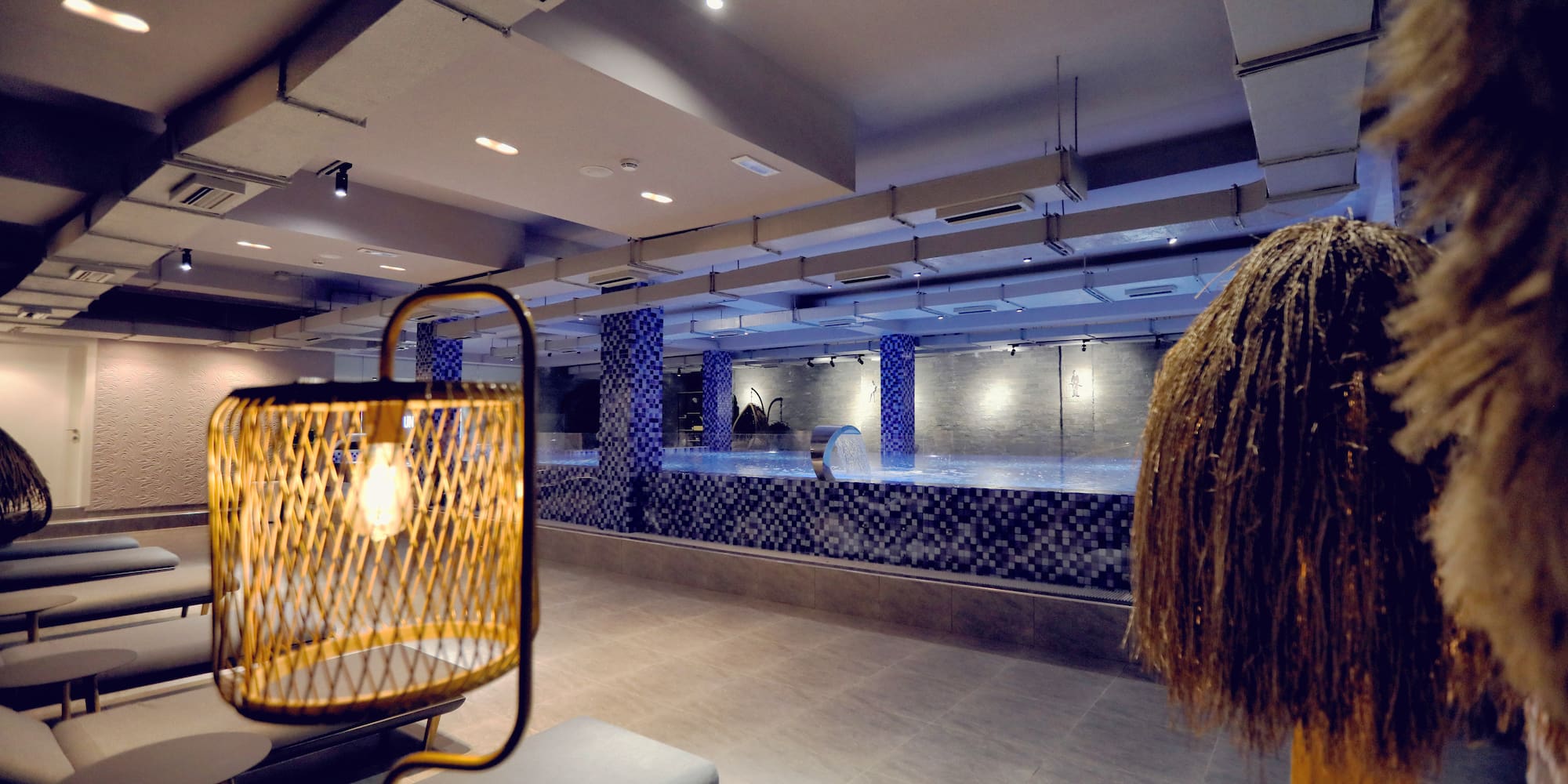 a room with a pool and a light fixture