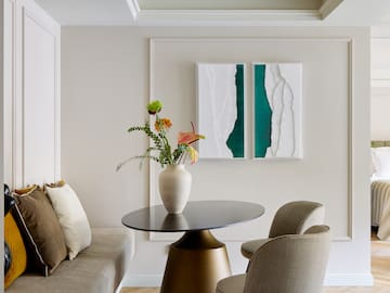 a vase of flowers on a table in a room