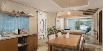 a dining room with a table and chairs