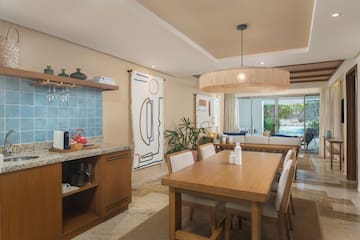 a dining room with a table and chairs