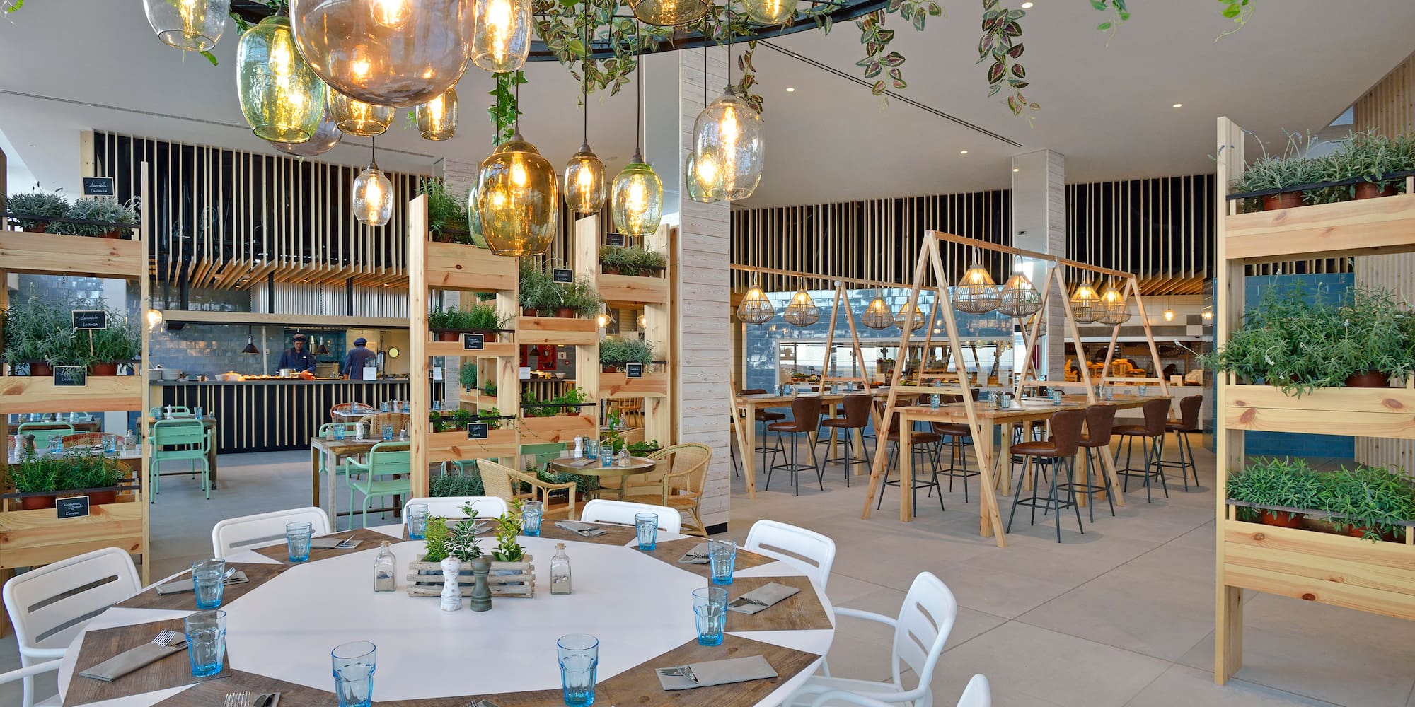a room with tables and chairs and a chandelier