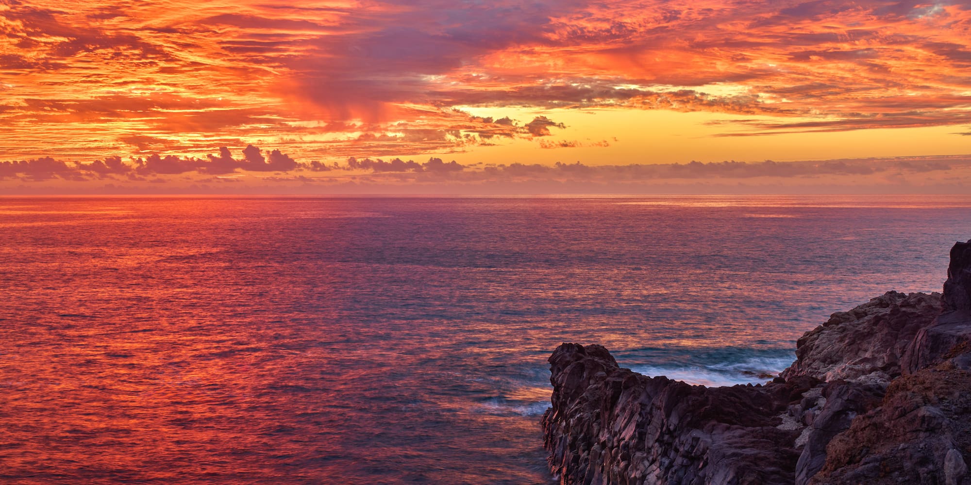 a sunset over the ocean