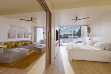 a bedroom with a large bed and a couch